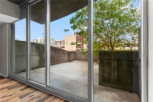 a bathroom with a glass shower door and mirror