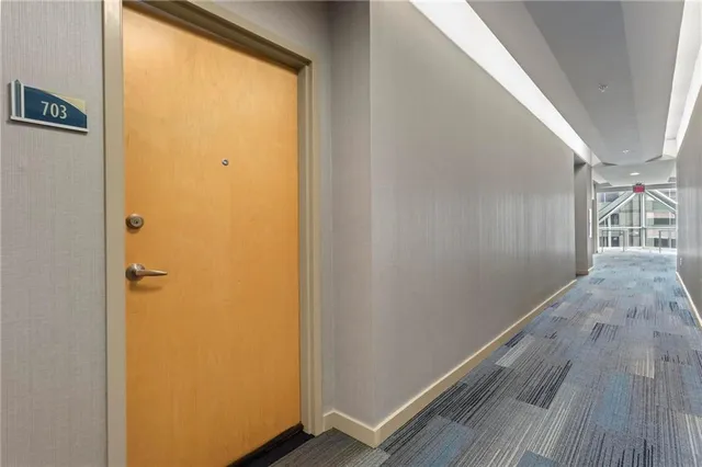 a view of hallway with wooden floor