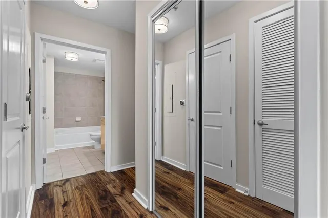 a view of bedroom with wooden floor