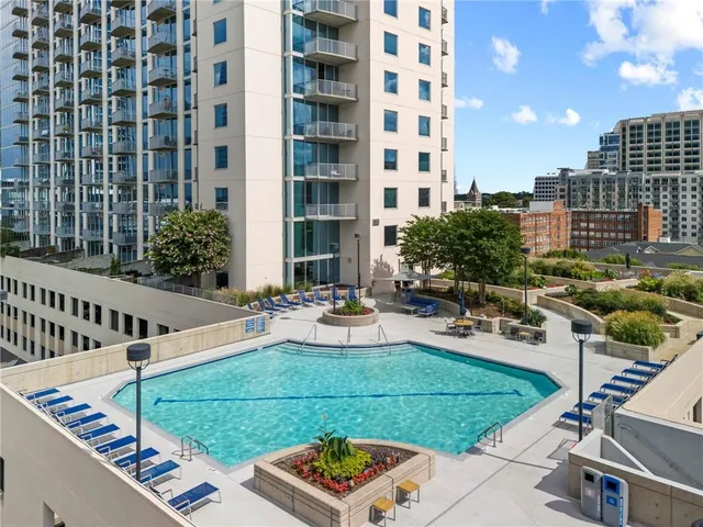 a view of a patio with couches and potted plants