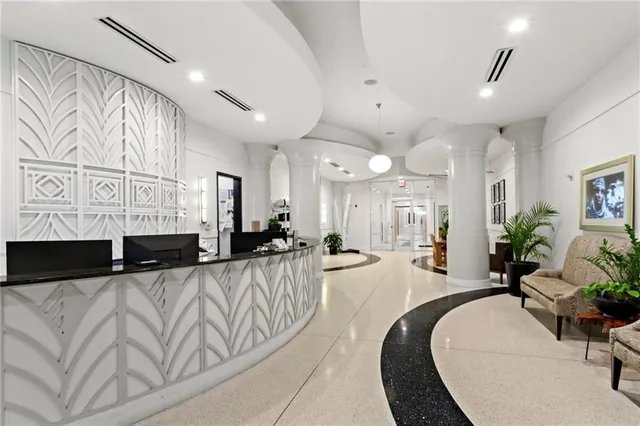 a large living room with stainless steel appliances kitchen island granite countertop furniture a couch and a view of living room