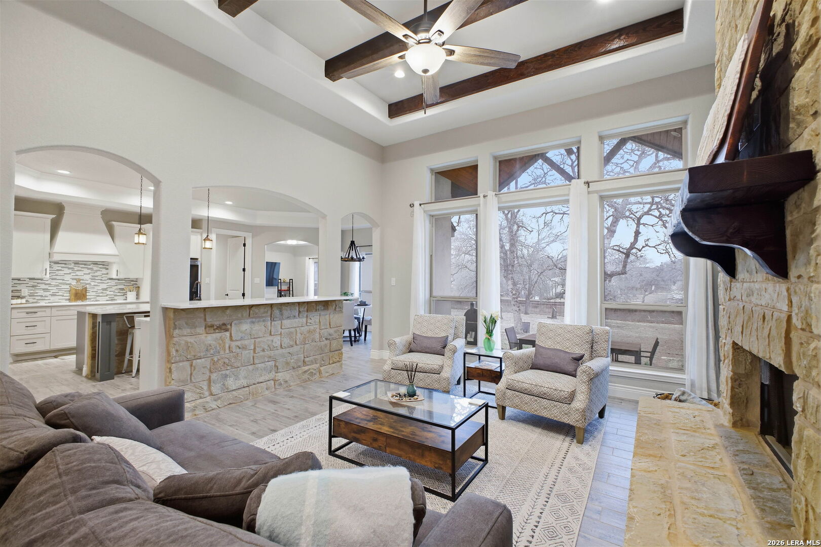 117 Crescent Ridge Adkins, TX 78101 - Photo 15 of 49 a living room with furniture fireplace and a chandelier