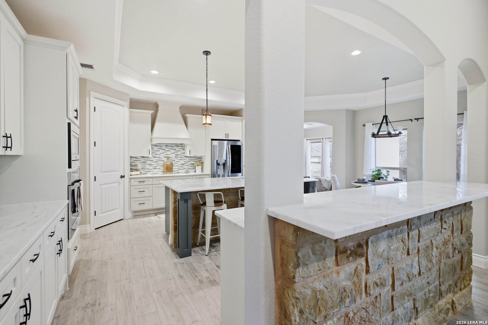 117 Crescent Ridge Adkins, TX 78101 - Photo 16 of 49 a kitchen with kitchen island a sink stove and refrigerator