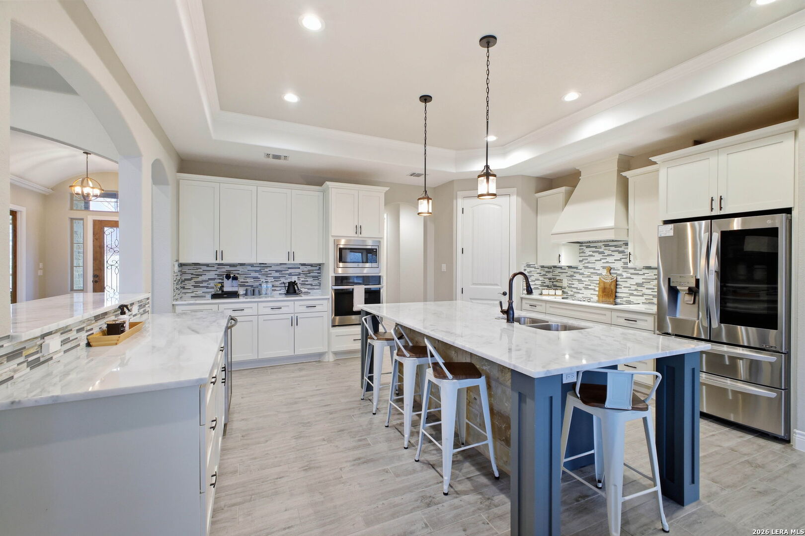117 Crescent Ridge Adkins, TX 78101 - Photo 17 of 49 a large kitchen with kitchen island a dining table and chairs