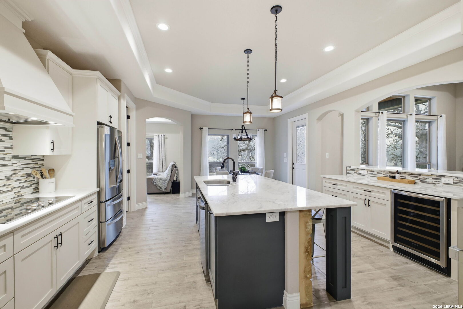 117 Crescent Ridge Adkins, TX 78101 - Photo 19 of 49 a large kitchen with stainless steel appliances kitchen island a large island in the center