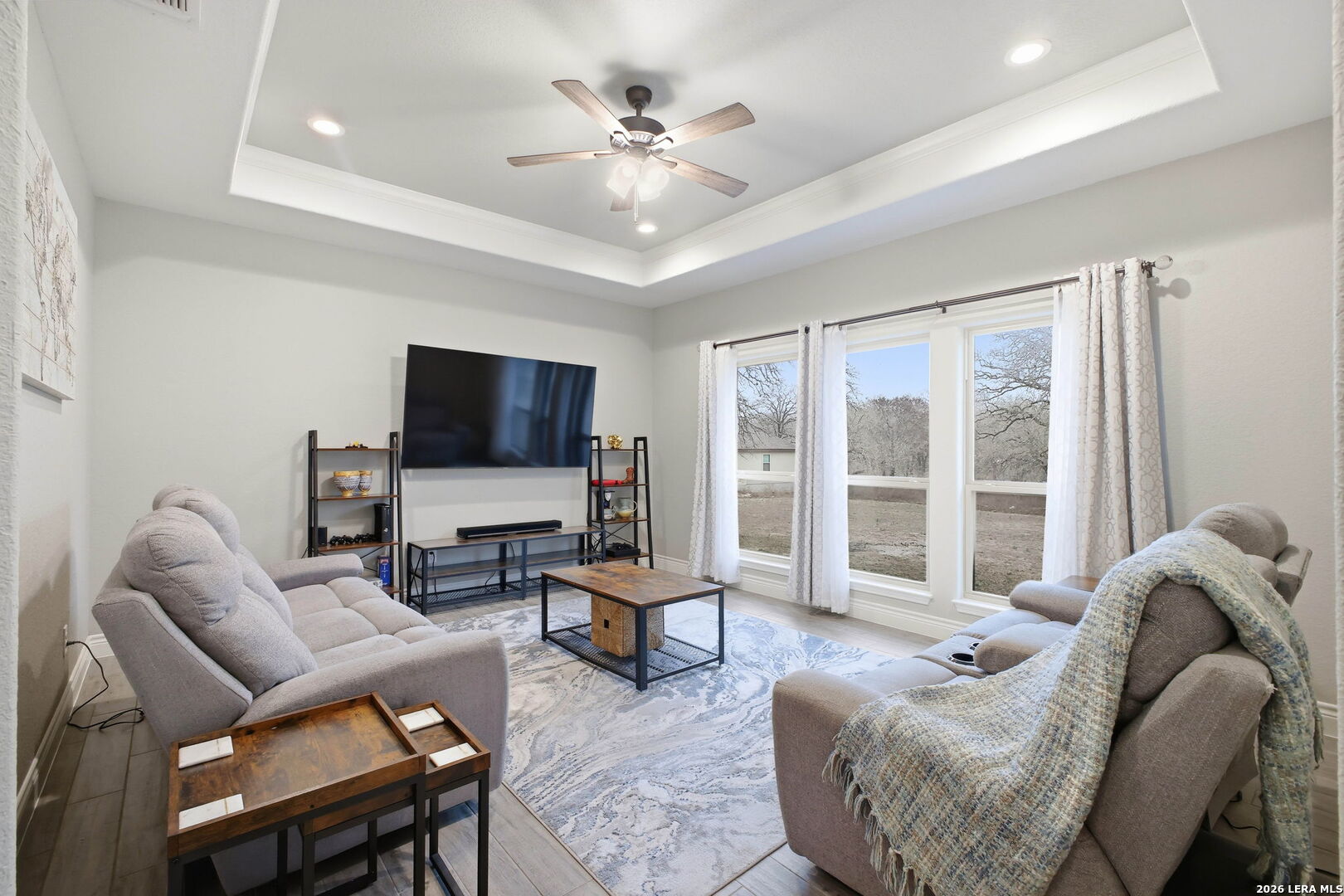 117 Crescent Ridge Adkins, TX 78101 - Photo 22 of 49 a living room with furniture a flat screen tv and a large window