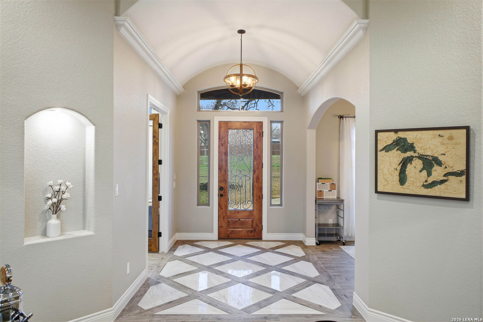 117 Crescent Ridge Adkins, TX 78101 - Photo 7 of 49 a view of a hallway with windows and chandelier