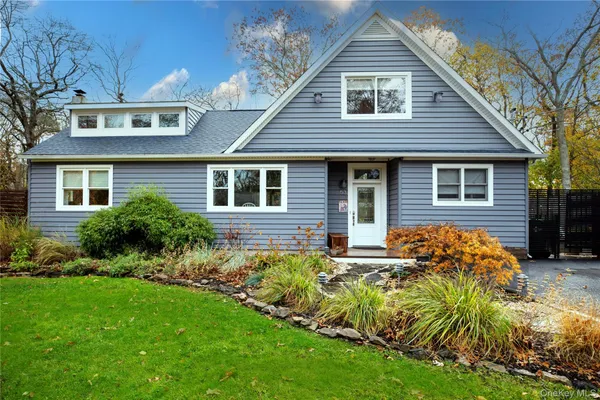 a backyard of a house with seating space