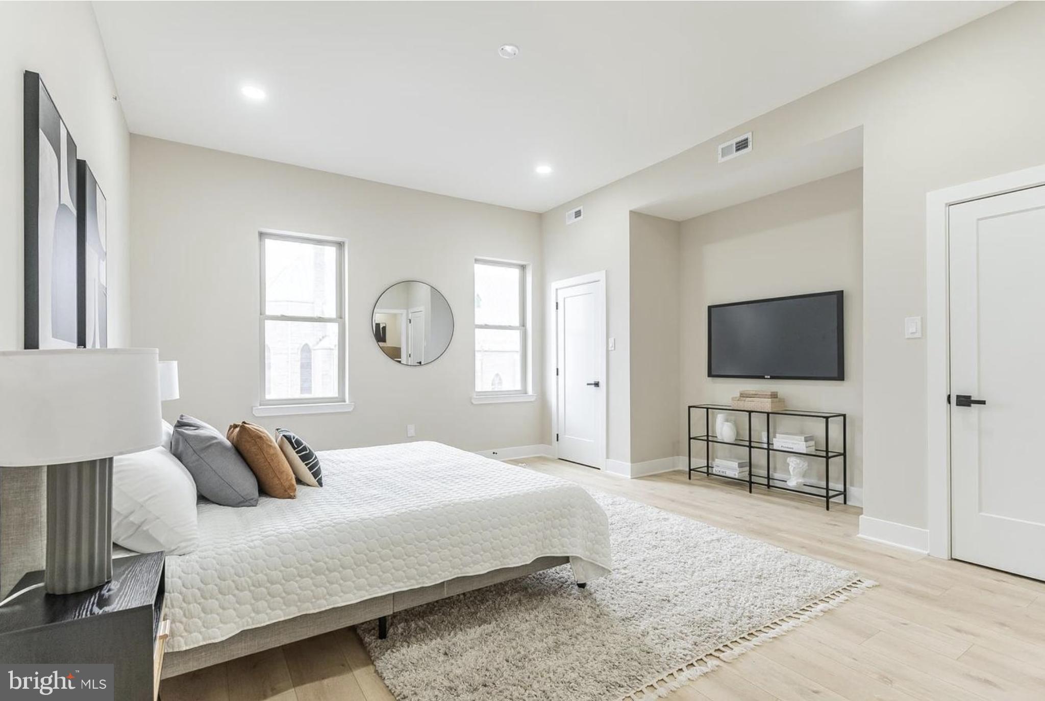 3223-29 Mercer Street Philadelphia, PA 19134 - Photo 13 of 25 a bedroom with bed and a flat screen tv