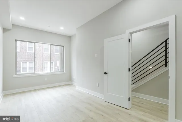 a view of an empty room with a window