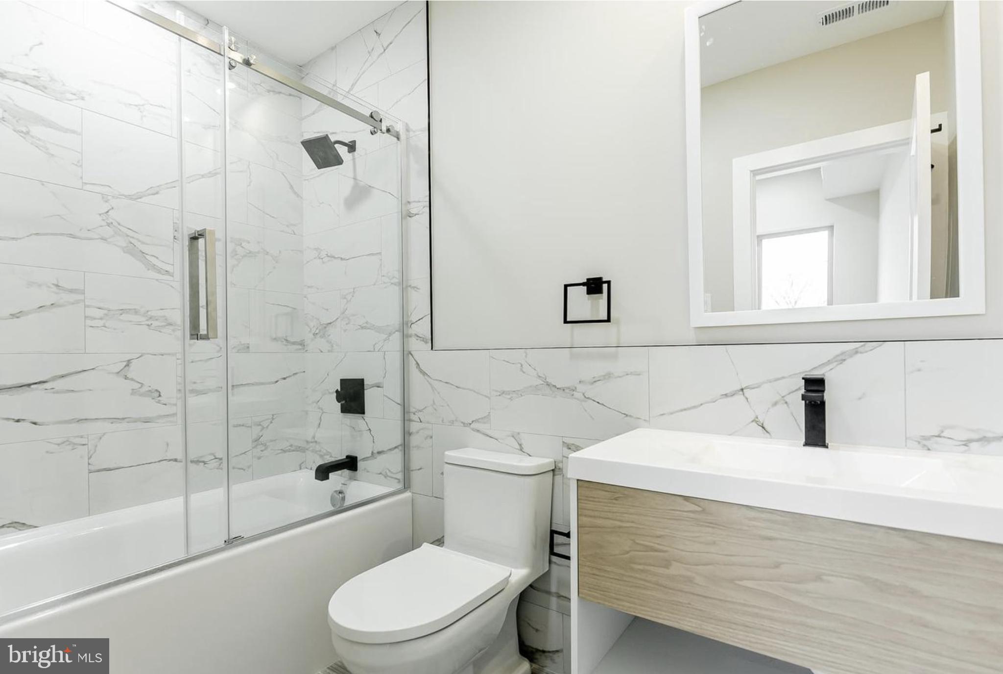 3223-29 Mercer Street Philadelphia, PA 19134 - Photo 19 of 25 a bathroom with a sink toilet and shower