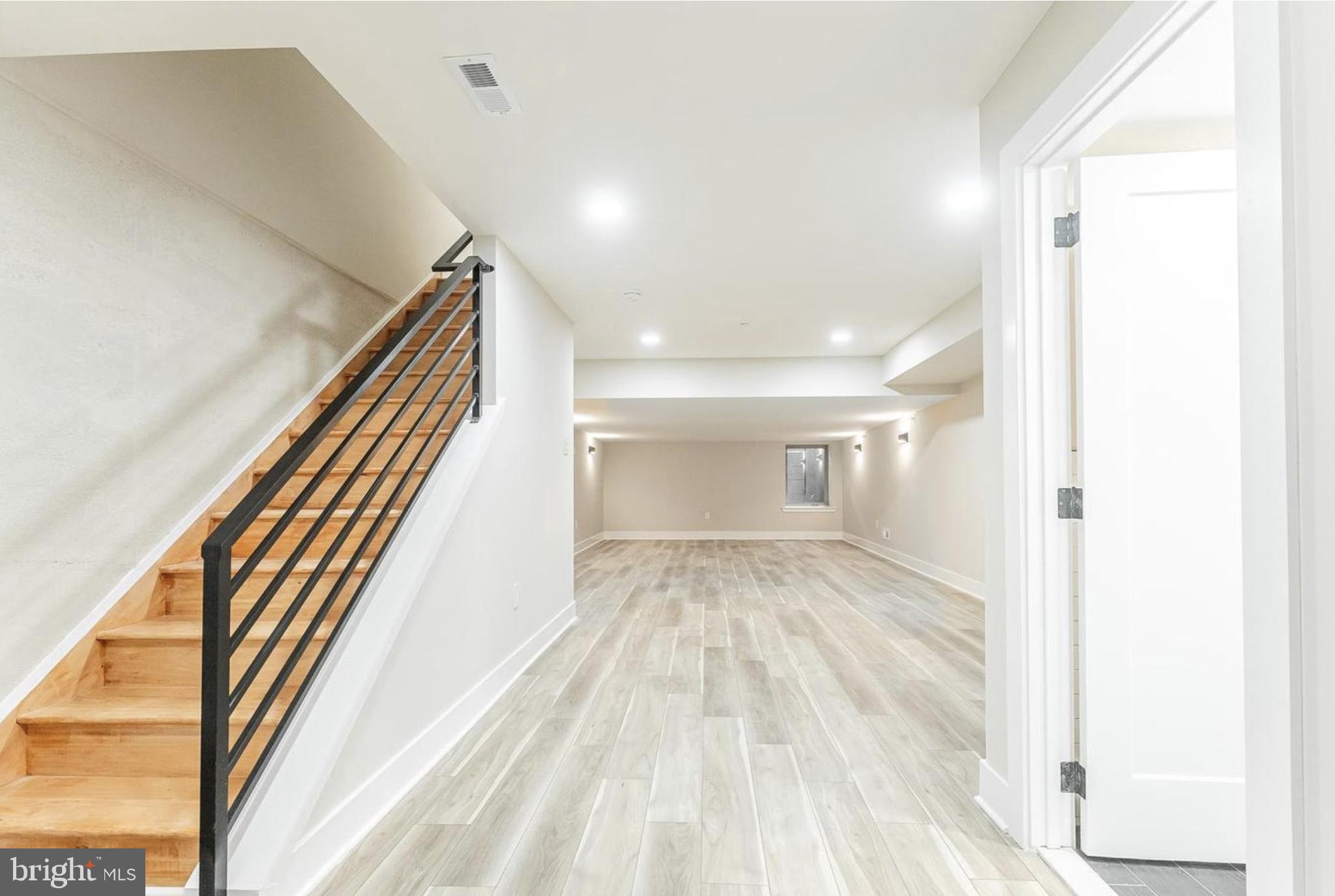 3223-29 Mercer Street Philadelphia, PA 19134 - Photo 22 of 25 a view of a hallway with wooden floor and staircase