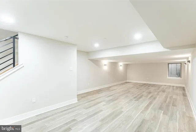 a bathroom with a toilet sink and shower