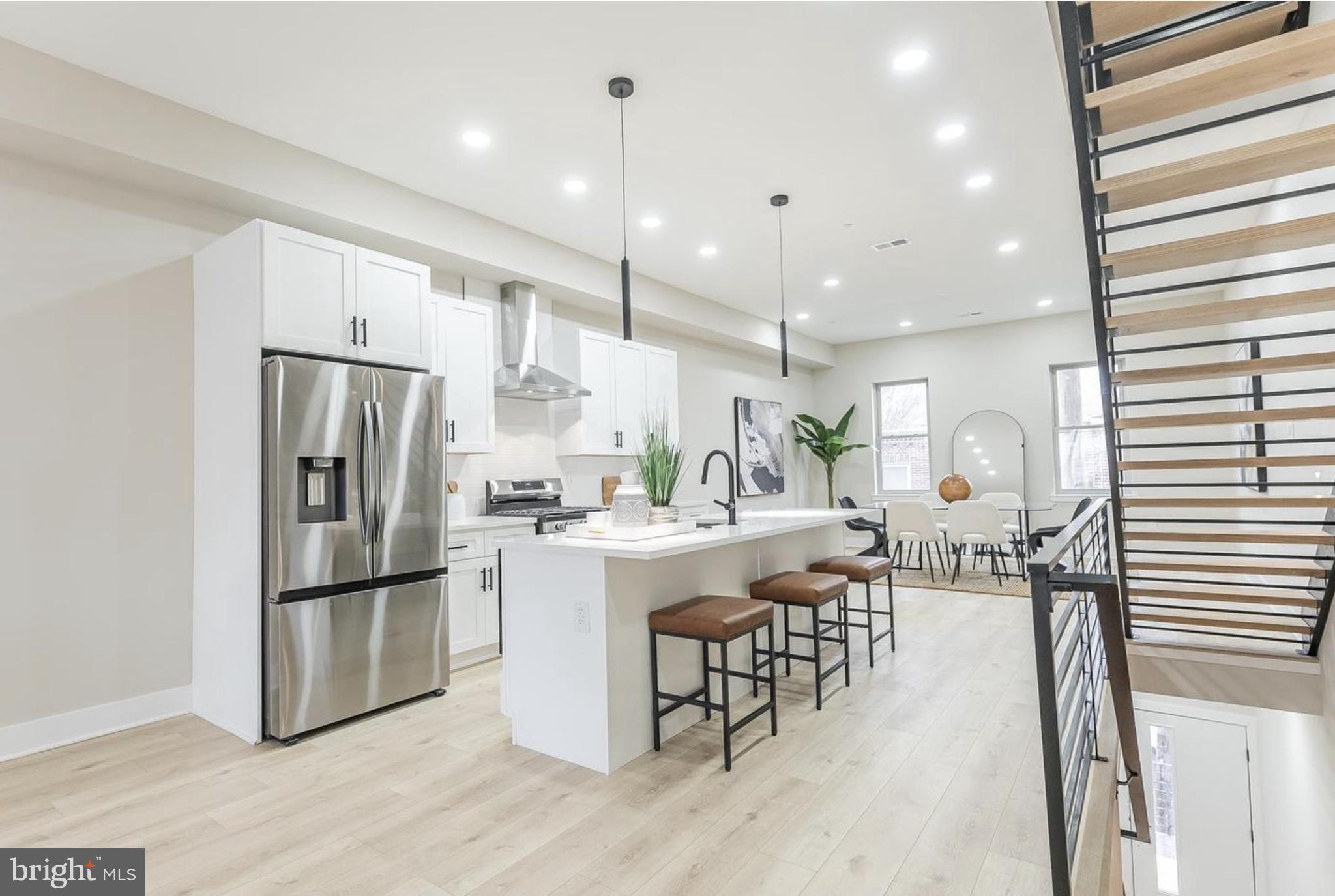 3223-29 Mercer Street Philadelphia, PA 19134 - Photo 4 of 25 a large kitchen with a table and chairs
