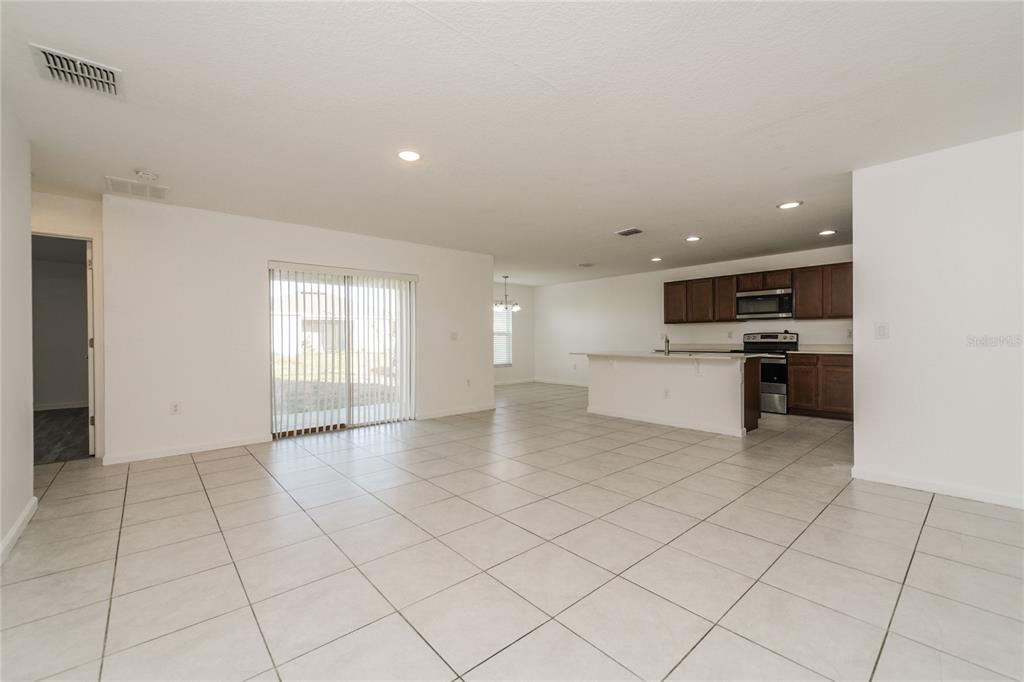 1477 Lucerne Loop Road Northeast Winter Haven, FL 33881 - Photo 2 of 15 a view of an empty room and window