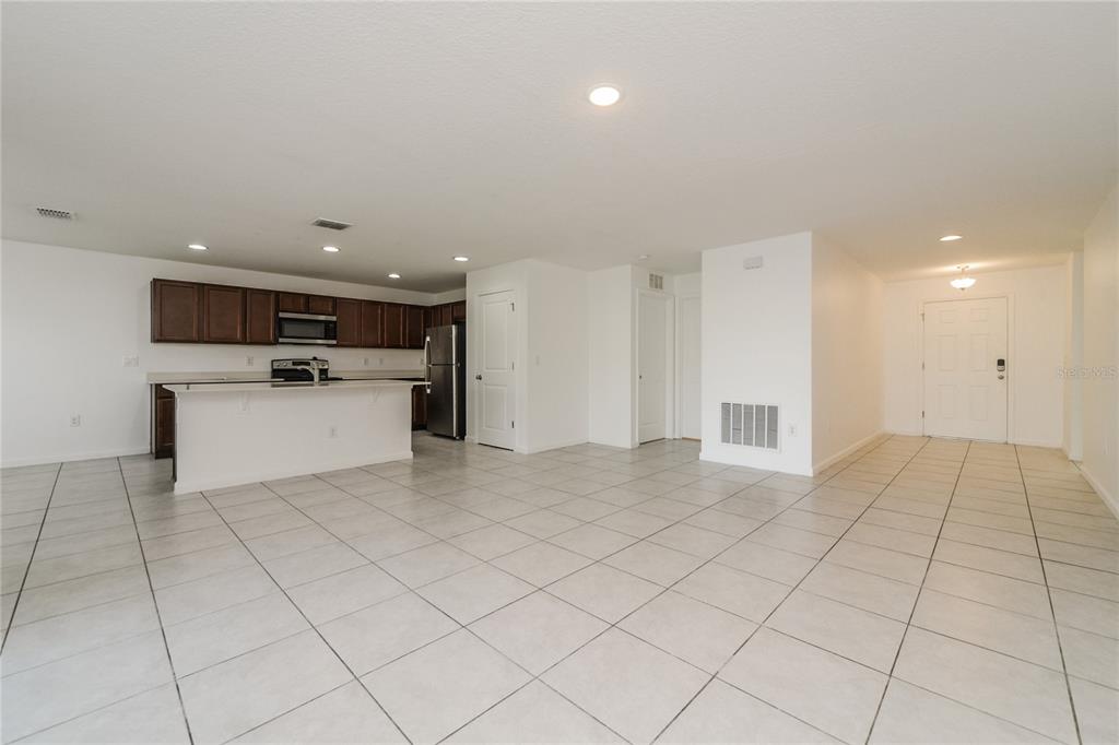 1477 Lucerne Loop Road Northeast Winter Haven, FL 33881 - Photo 6 of 15 a view of kitchen with white cabinets