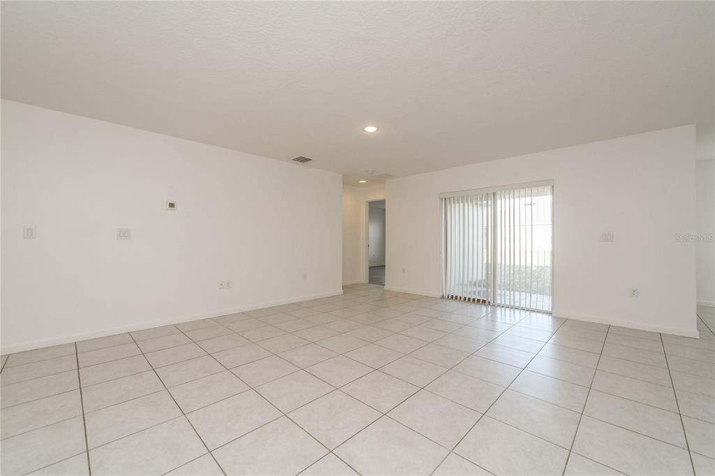 1477 Lucerne Loop Road Northeast Winter Haven, FL 33881 - Photo 7 of 15 a view of an empty room and window