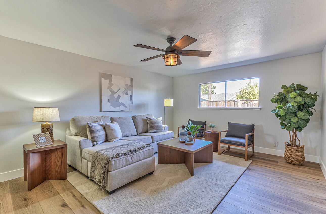 242 Howes Drive Los Gatos, CA 95032 - Photo 15 of 37 a living room with furniture potted plant and a window