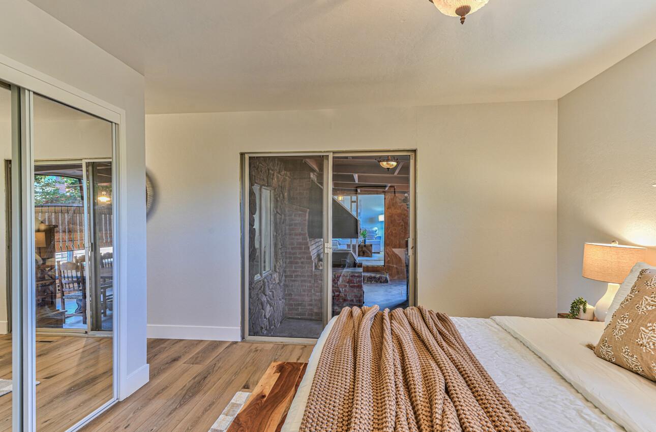 242 Howes Drive Los Gatos, CA 95032 - Photo 22 of 37 a bedroom with a bed and wooden floor