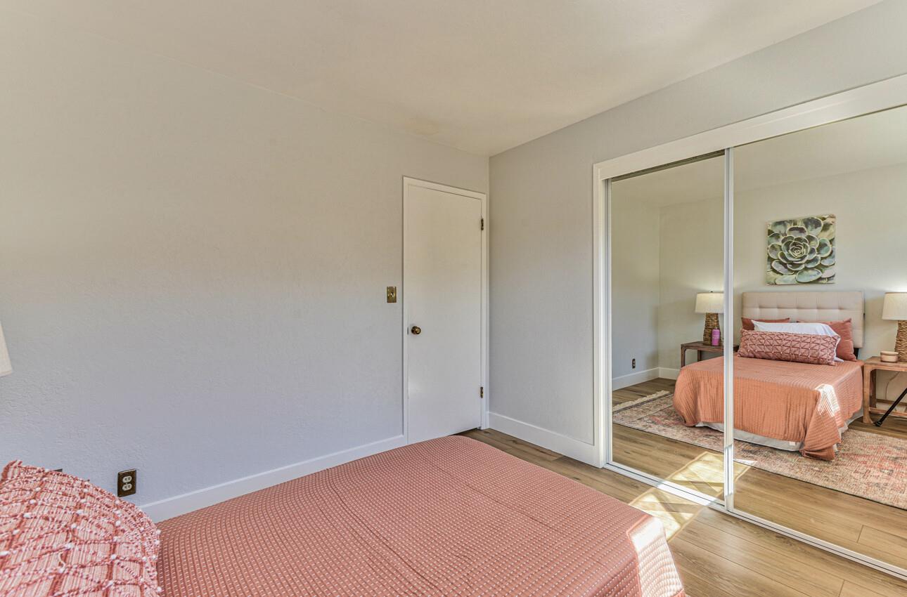 242 Howes Drive Los Gatos, CA 95032 - Photo 25 of 37 a bedroom with a bed and wooden floor