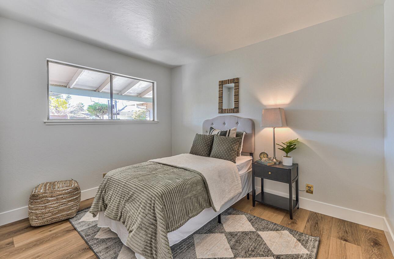 242 Howes Drive Los Gatos, CA 95032 - Photo 26 of 37 a bedroom with a bed and a chair