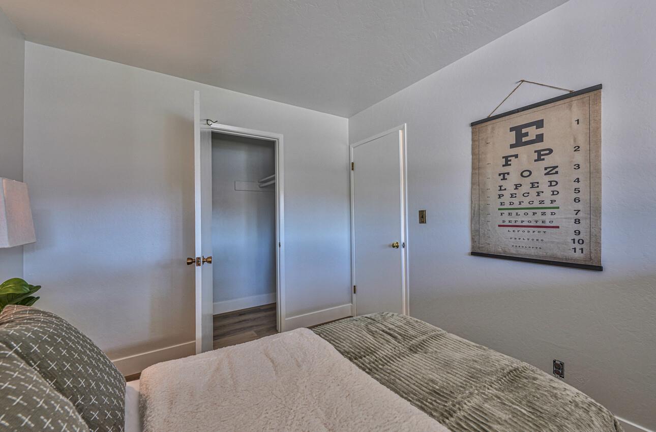 242 Howes Drive Los Gatos, CA 95032 - Photo 27 of 37 a bedroom with a bed and a painting on the wall