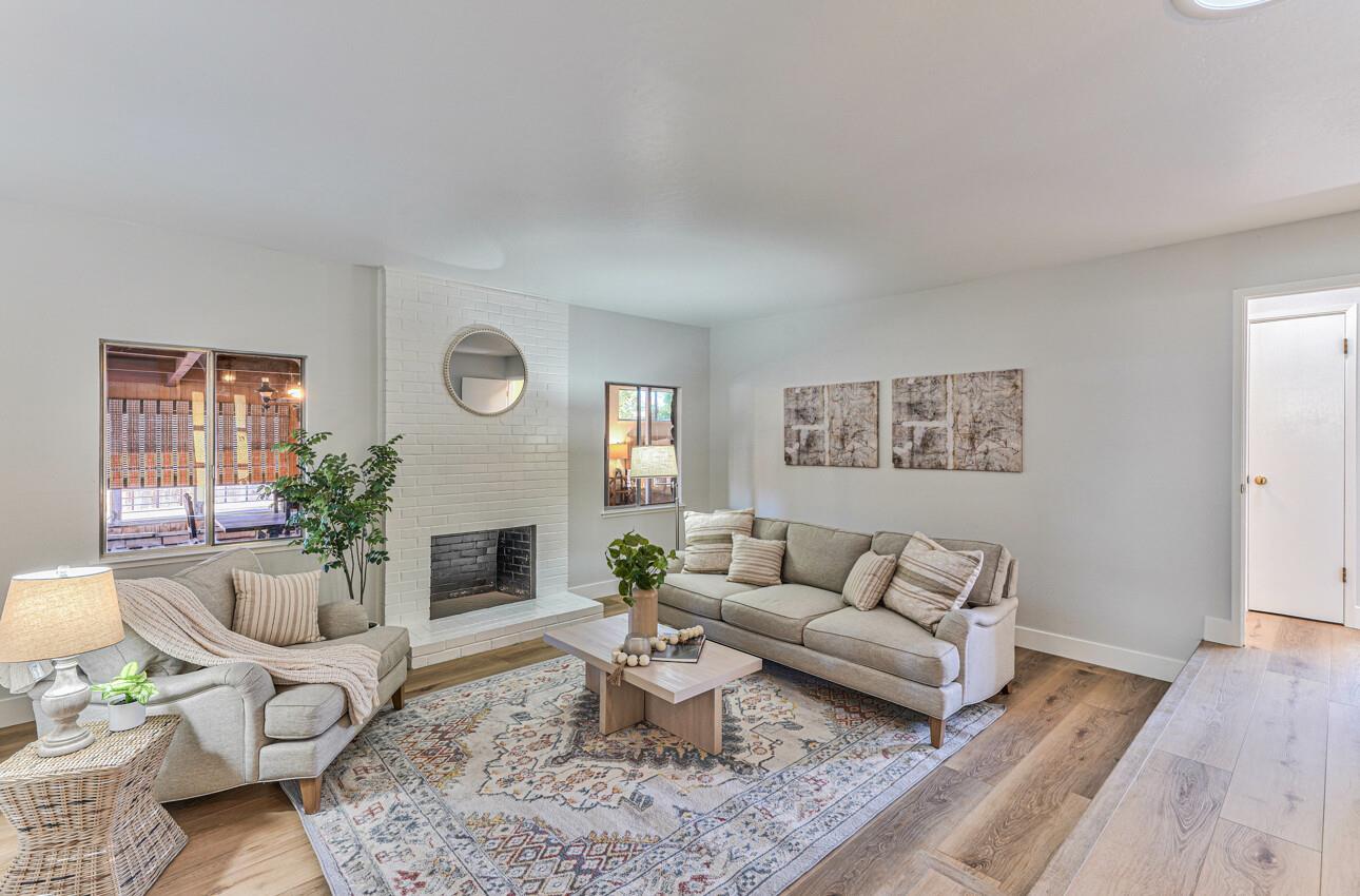 242 Howes Drive Los Gatos, CA 95032 - Photo 5 of 37 a living room with furniture and a fireplace