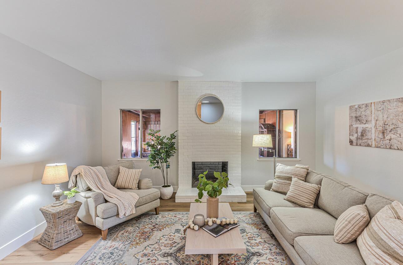 242 Howes Drive Los Gatos, CA 95032 - Photo 8 of 37 a living room with furniture a fireplace and a potted plant