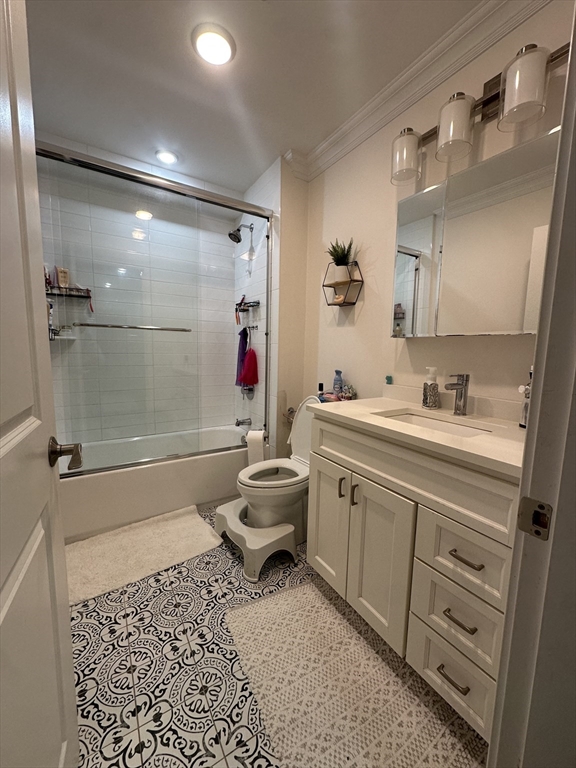 56 Cedar Street, Unit 2 Boston, MA 02119 - Photo 15 of 16 a bathroom with a sink toilet and shower
