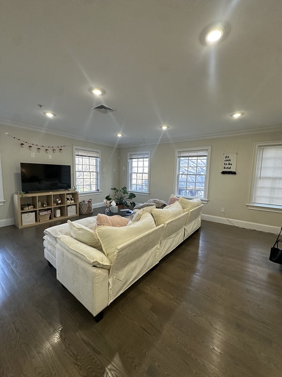 56 Cedar Street, Unit 2 Boston, MA 02119 - Photo 2 of 16 a living room with furniture and a flat screen tv