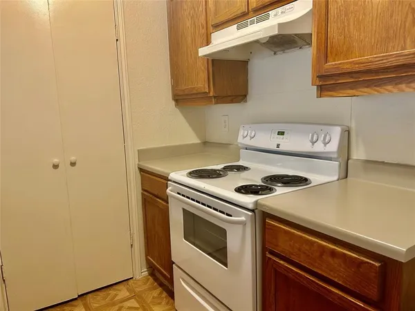 a kitchen with a stove and a microwave