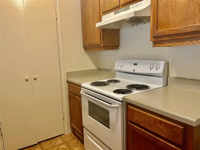 a kitchen with a stove and a microwave