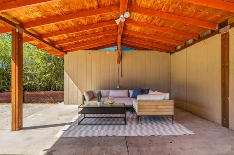 a view of backyard with a patio