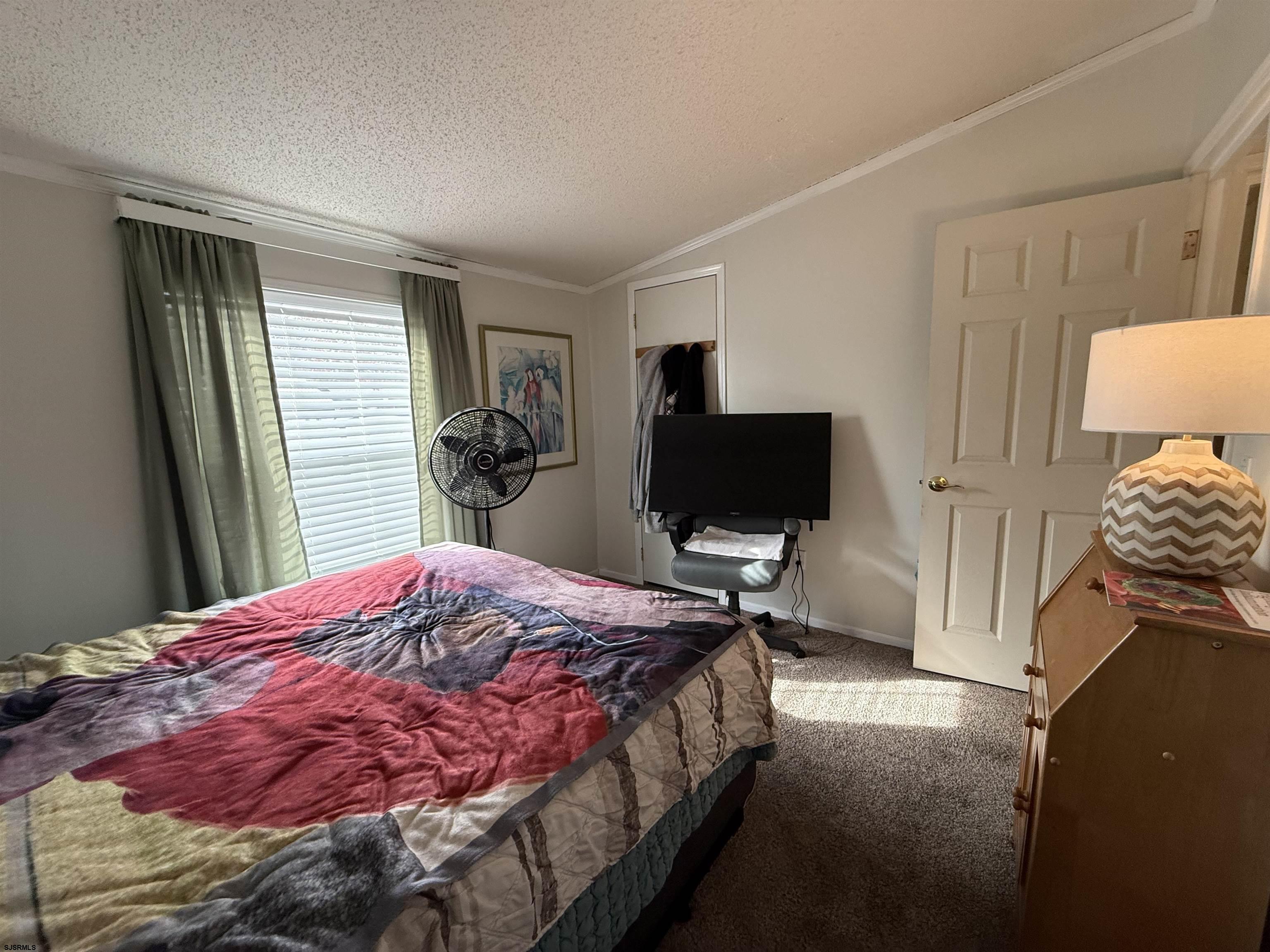 141 Country Lane Buena, NJ 08310 - Photo 16 of 24 a bedroom with a bed and a flat screen tv