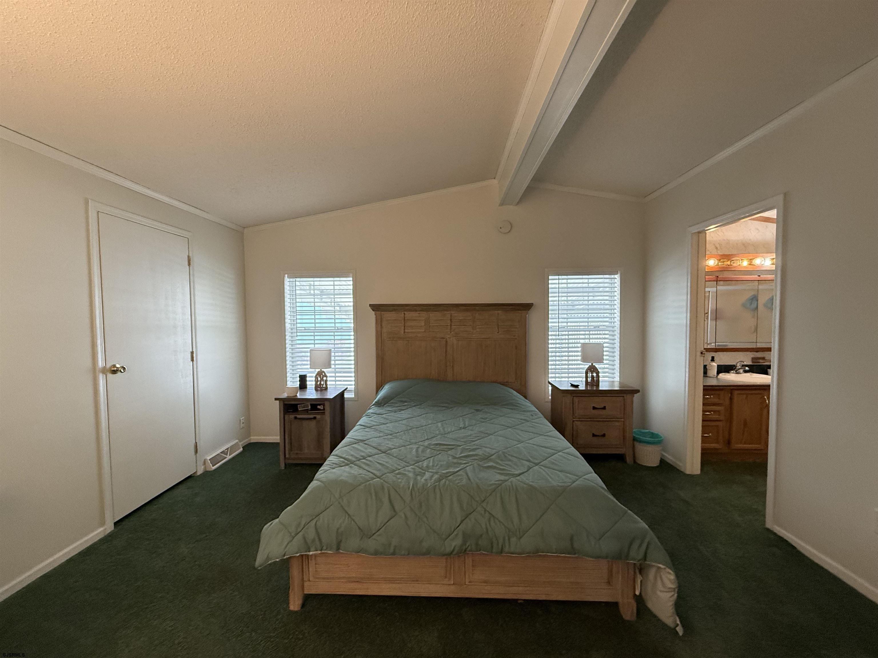 141 Country Lane Buena, NJ 08310 - Photo 17 of 24 a spacious bedroom with a bed and a window