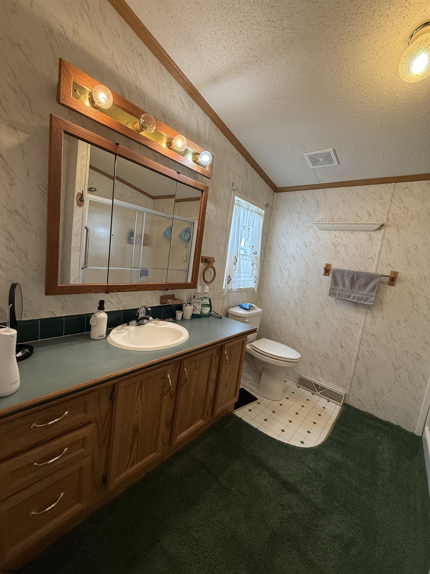 141 Country Lane Buena, NJ 08310 - Photo 19 of 24 a bathroom with a sink and a mirror