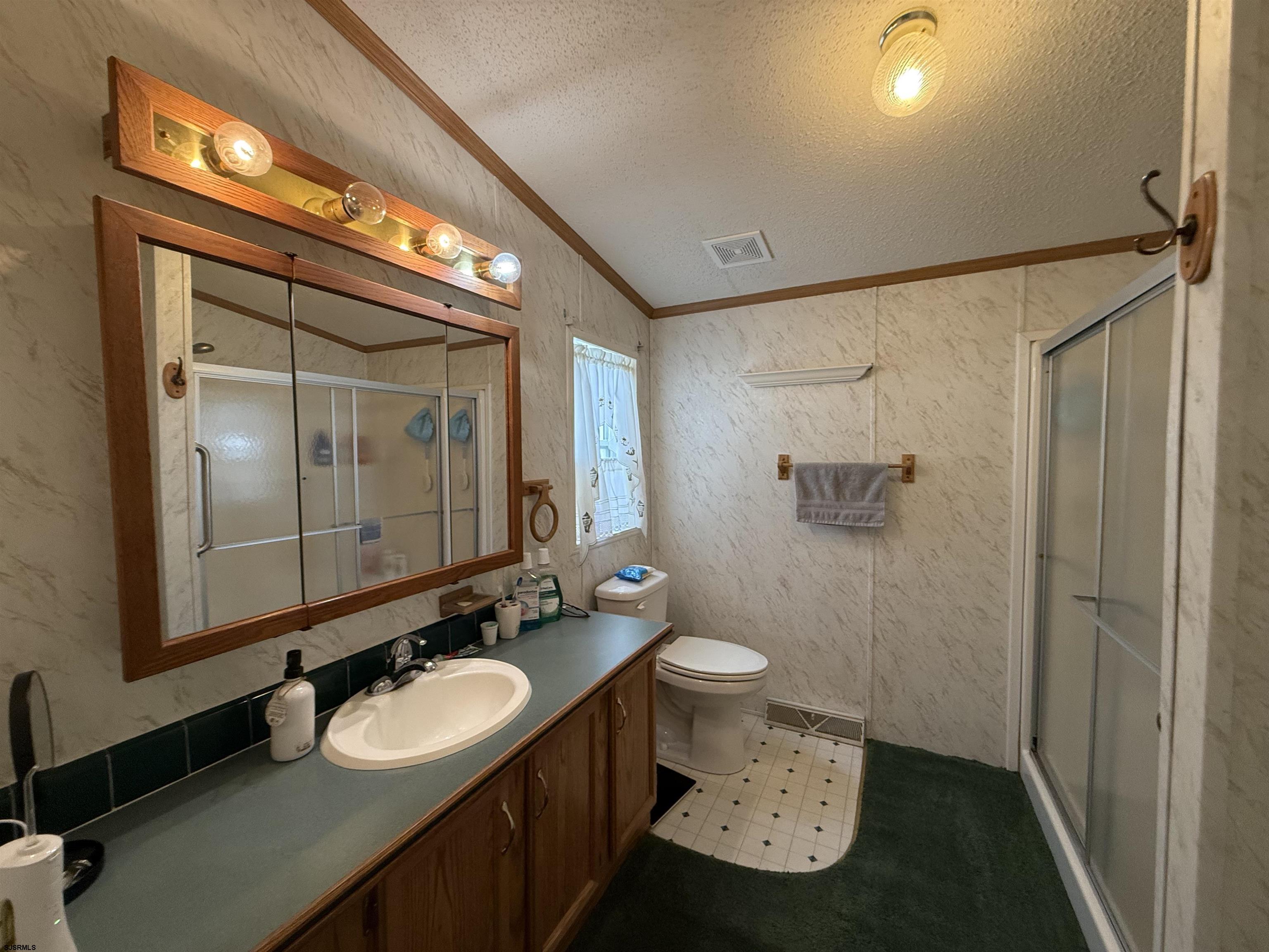 141 Country Lane Buena, NJ 08310 - Photo 20 of 24 a bathroom with a sink and a mirror