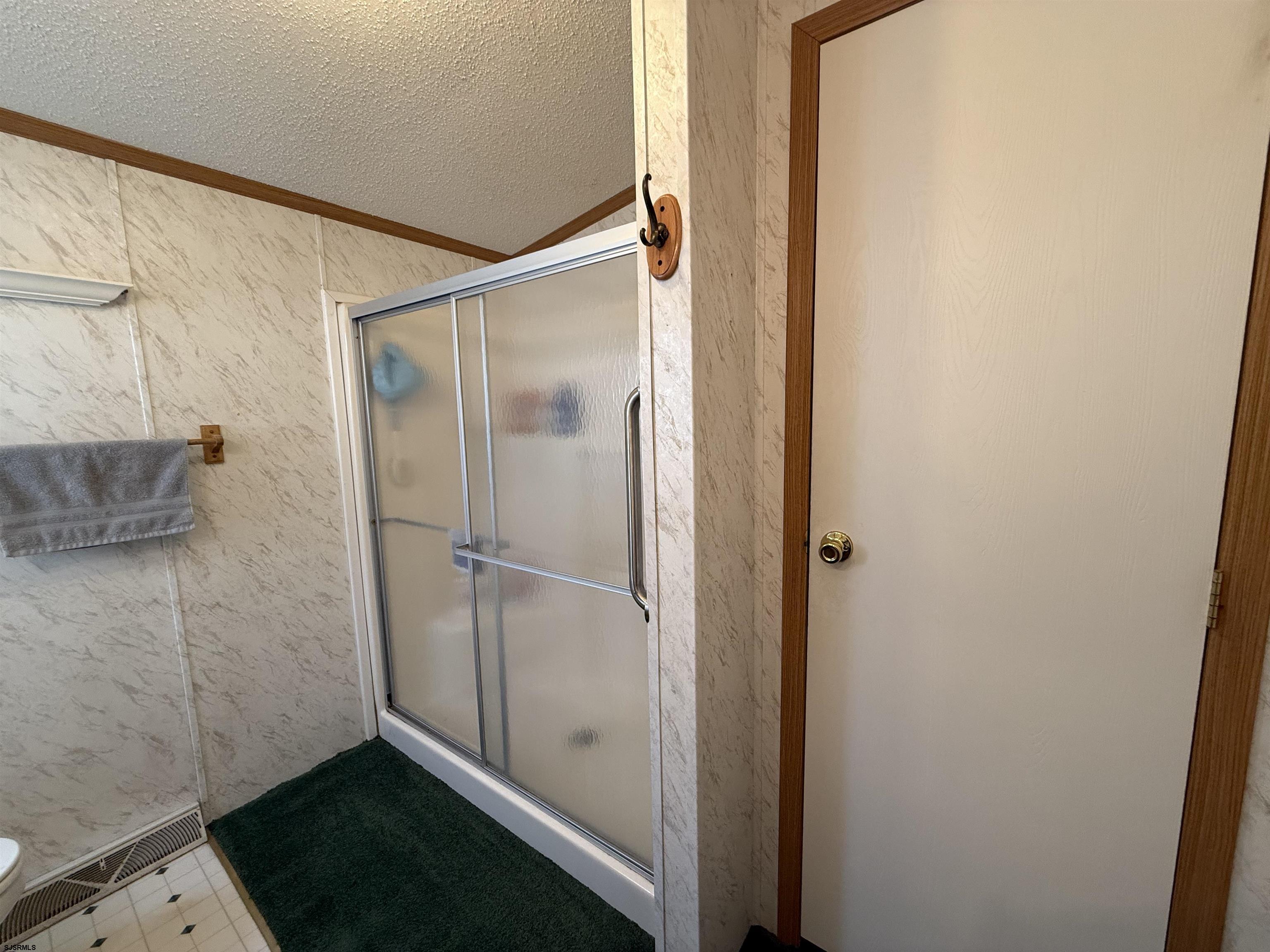 141 Country Lane Buena, NJ 08310 - Photo 21 of 24 a bathroom with a glass shower door