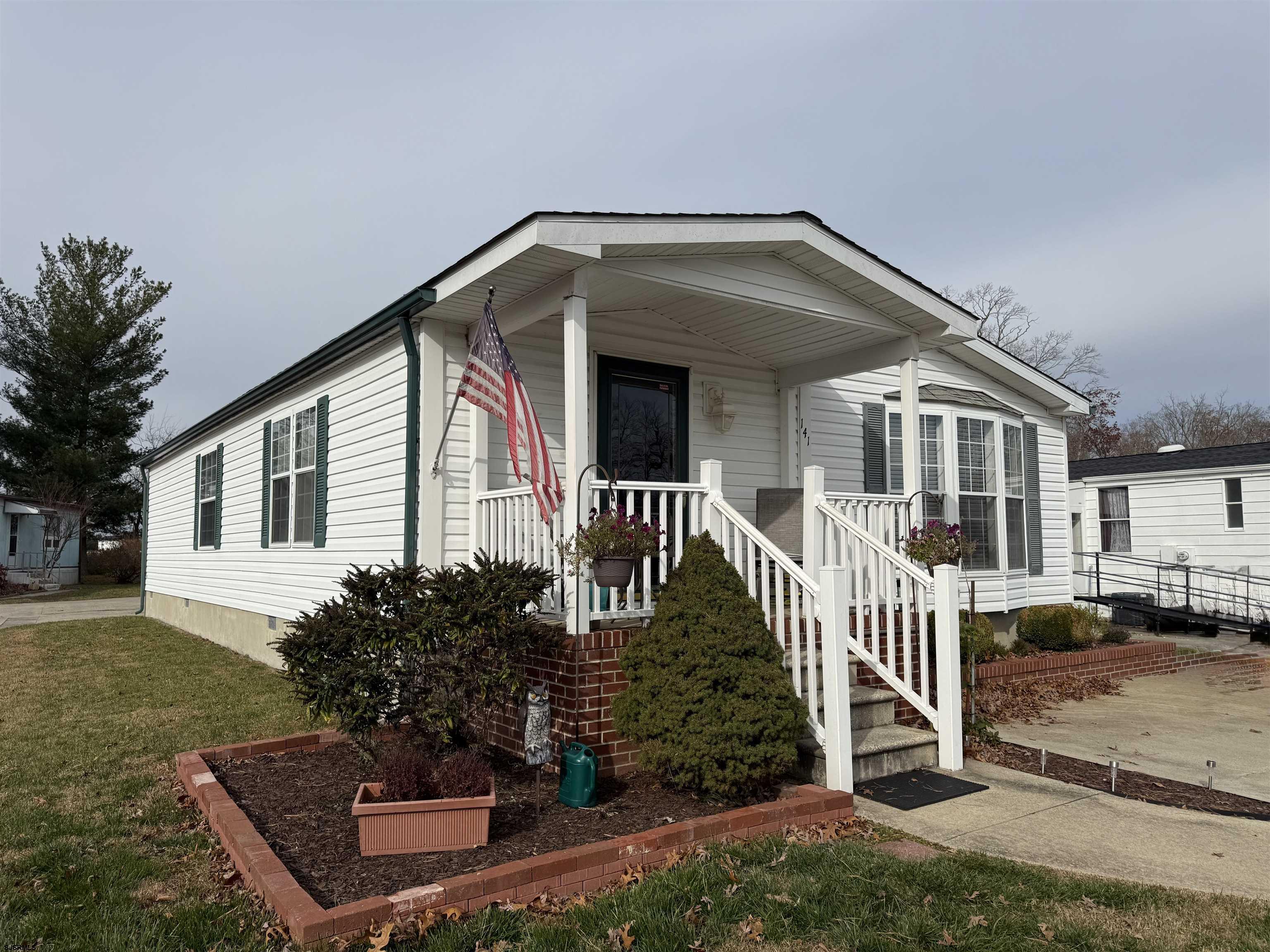 141 Country Lane Buena, NJ 08310 - Photo 22 of 24 a front view of a house with a yard