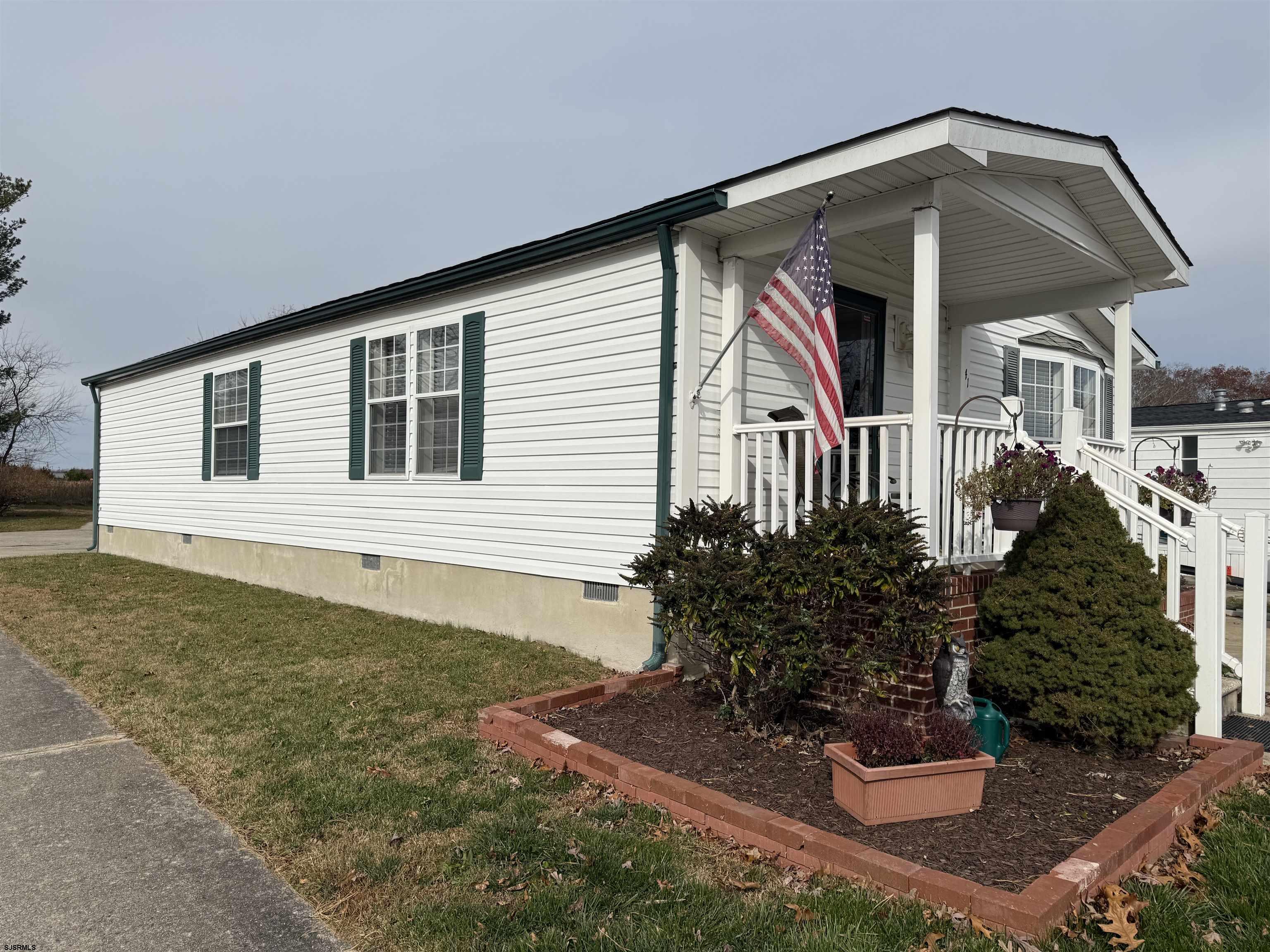 141 Country Lane Buena, NJ 08310 - Photo 23 of 24 a front view of a house with garden
