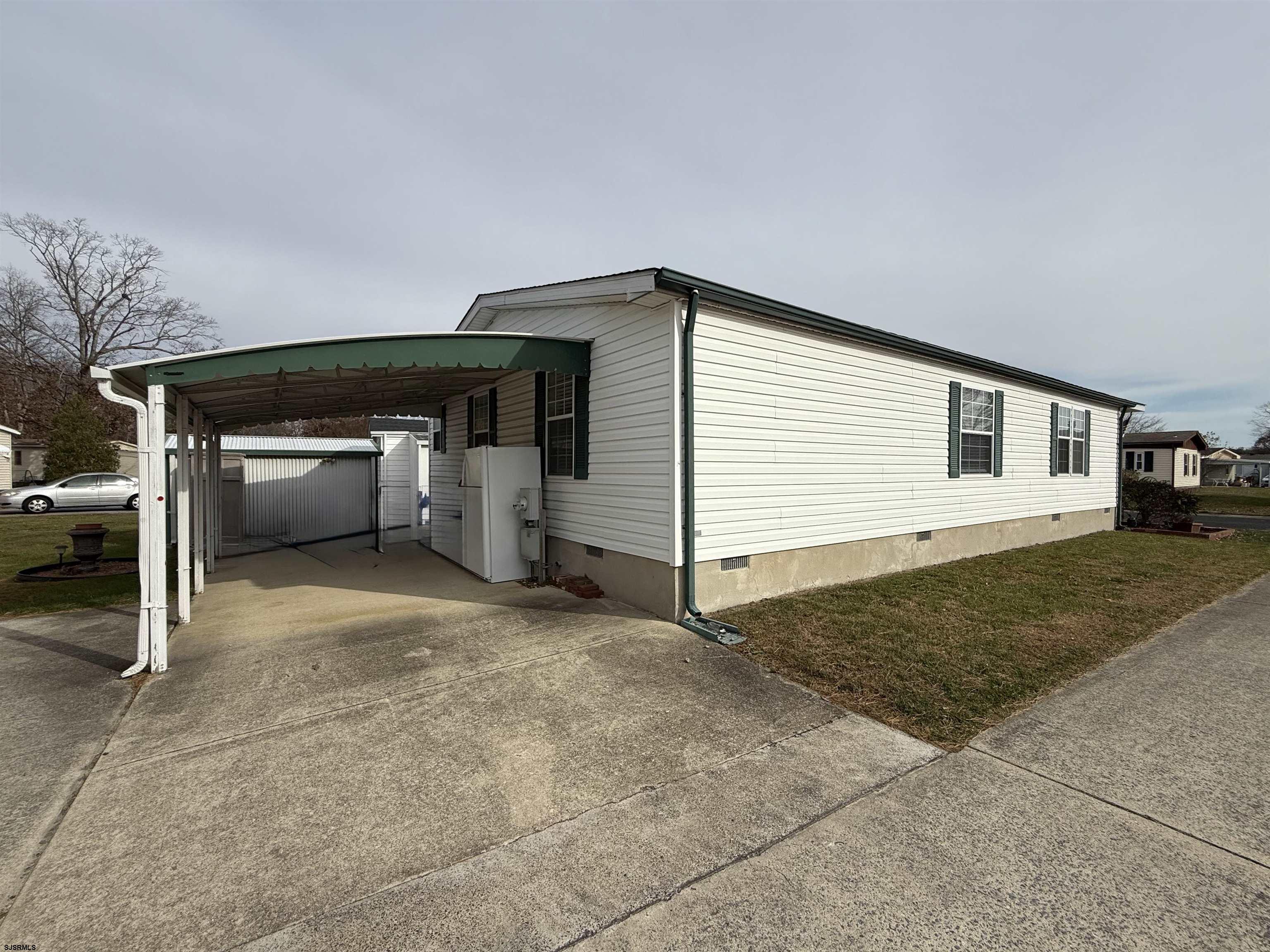 141 Country Lane Buena, NJ 08310 - Photo 24 of 24 a view of backyard and car parked