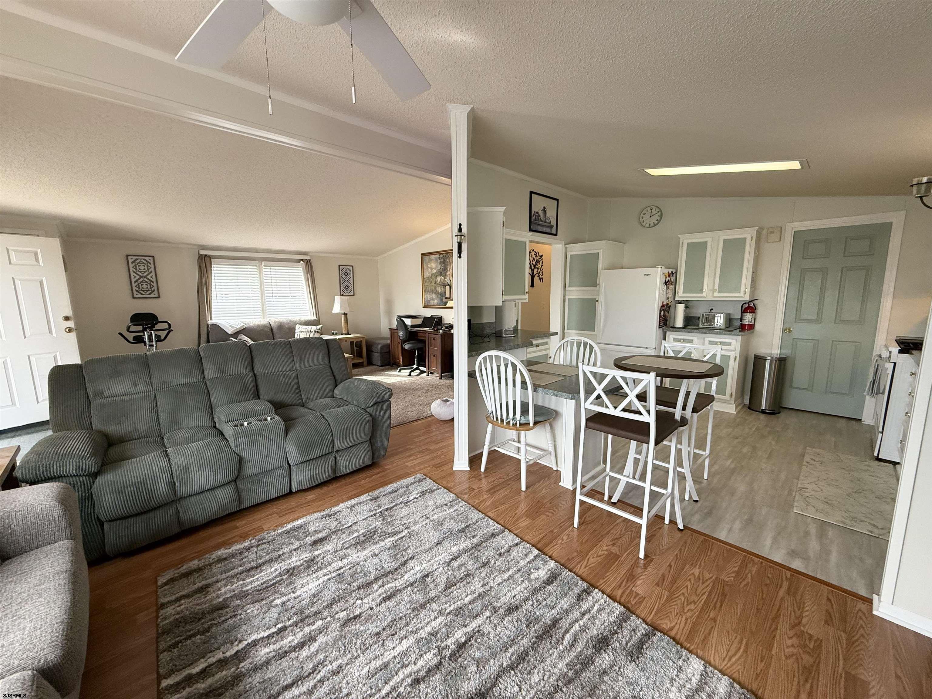 141 Country Lane Buena, NJ 08310 - Photo 4 of 24 a living room with furniture wooden floor and a table