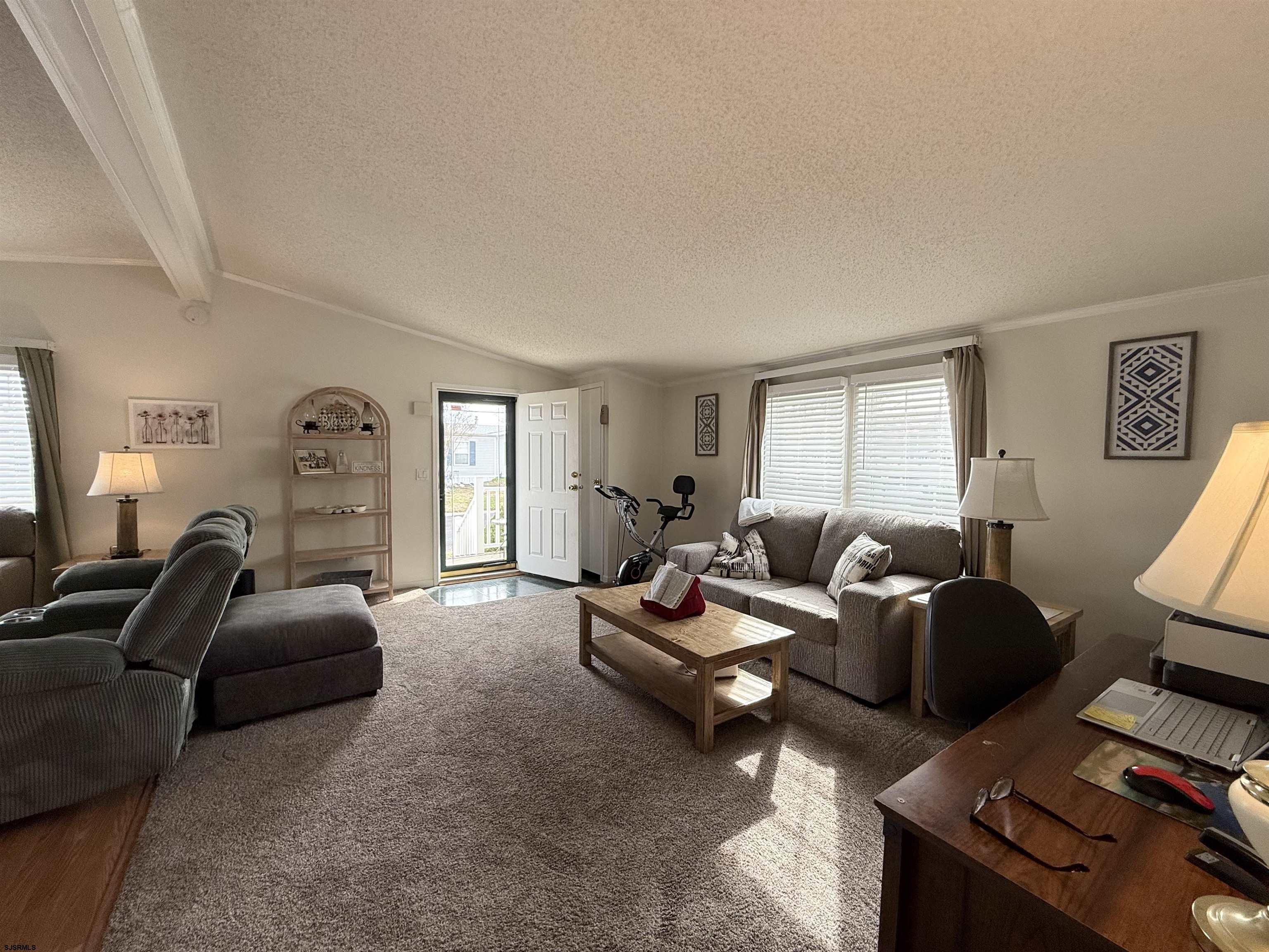 141 Country Lane Buena, NJ 08310 - Photo 10 of 24 a living room with furniture a window and a flat screen tv