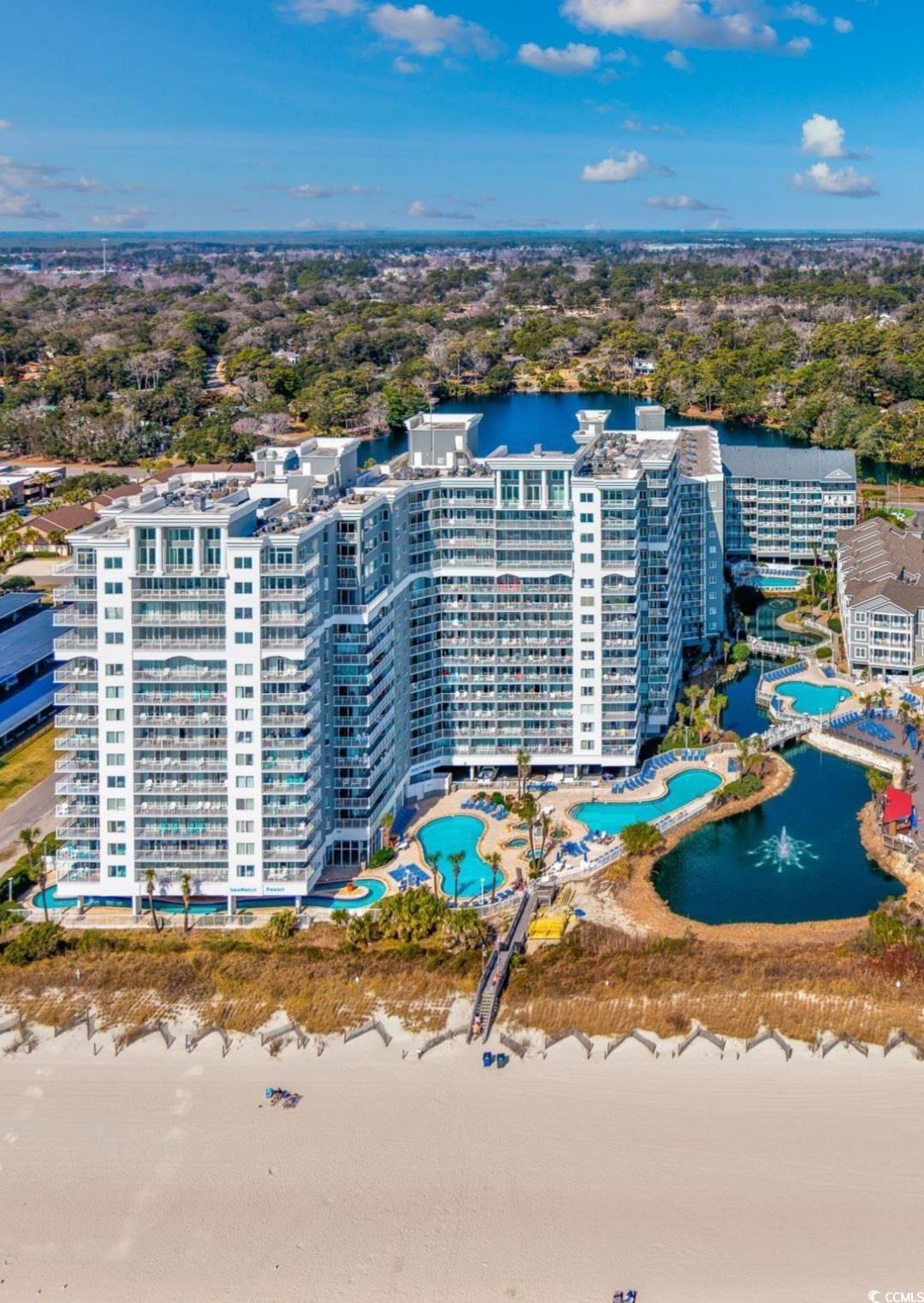 161 Seawatch Drive, Unit 414 Myrtle Beach, SC 29572 - Photo 14 of 15 Bird's eye view of a pool area and a large body of water