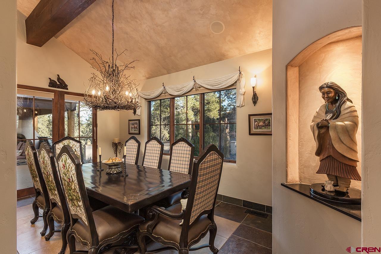 304 Peak Trail Hesperus, CO 81326 - Photo 13 of 35 a view of a dining room with furniture and chandelier