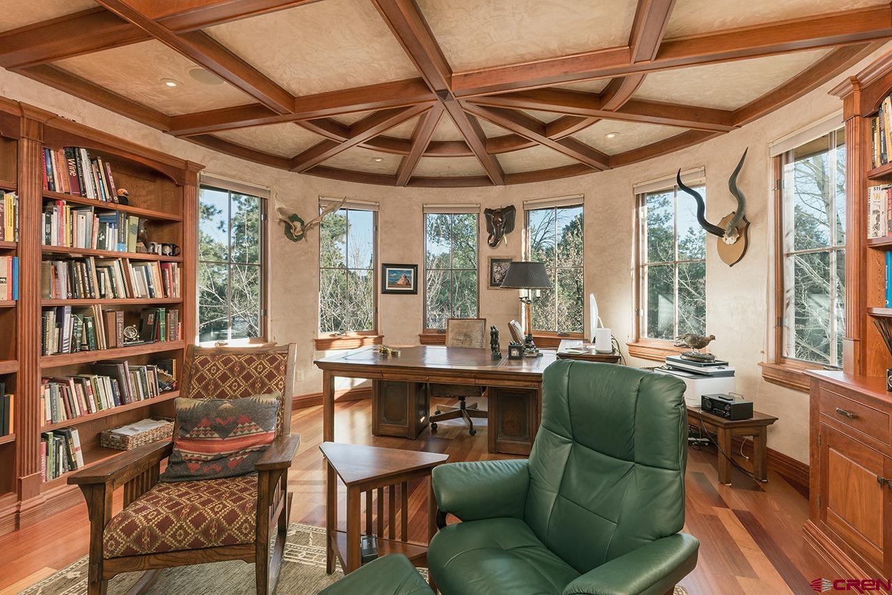 304 Peak Trail Hesperus, CO 81326 - Photo 21 of 35 a living room with furniture a flat screen tv and a large window