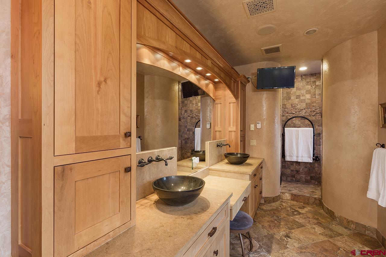 304 Peak Trail Hesperus, CO 81326 - Photo 24 of 35 a bathroom with a sink and a mirror