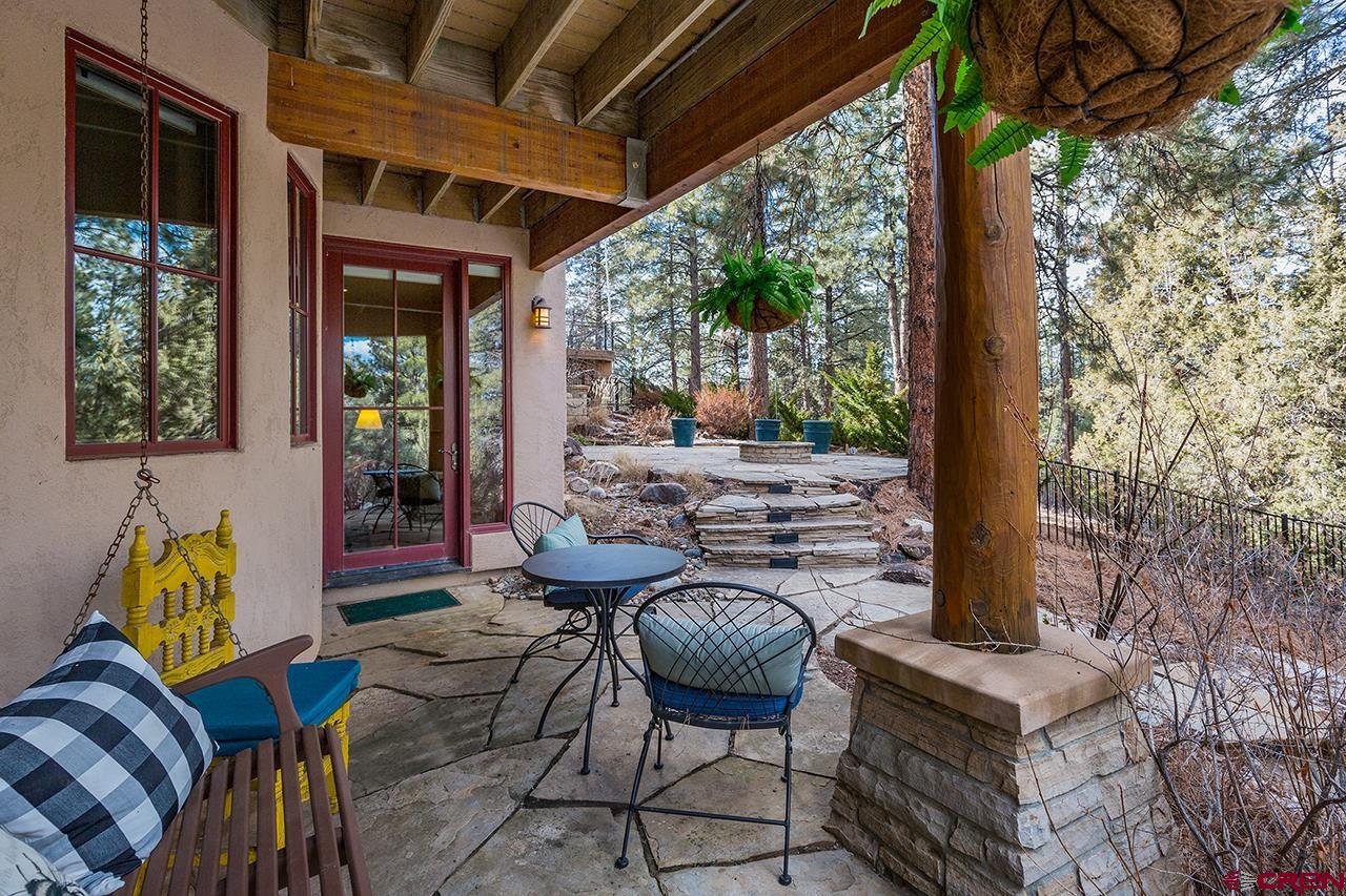 304 Peak Trail Hesperus, CO 81326 - Photo 28 of 35 a outdoor space with patio couch and a fireplace