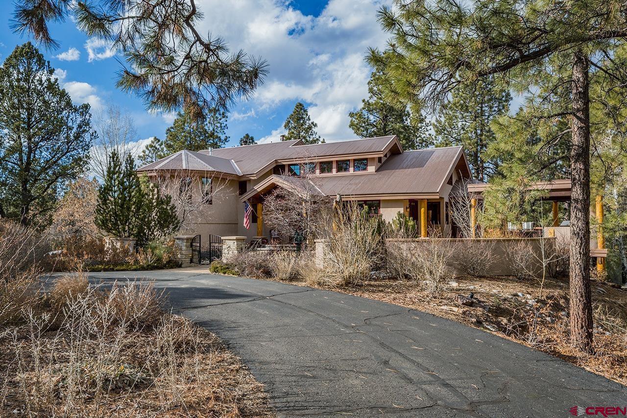 304 Peak Trail Hesperus, CO 81326 - Photo 3 of 35 a view of a house with a yard and sitting area