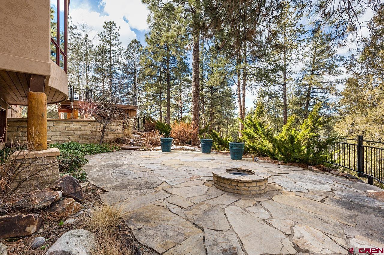 304 Peak Trail Hesperus, CO 81326 - Photo 7 of 35 a view of a backyard with table and chairs with wooden fence